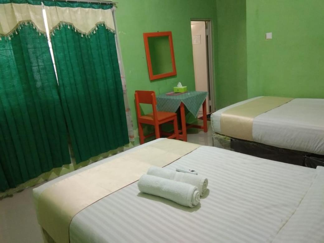 Hotel Krui Syariah Экстерьер фото